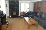 Mammoth Lakes Condo Rental Sunshine Village 159 - Living Room with a Woodstove